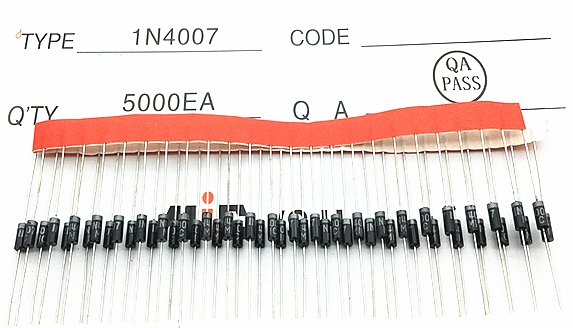 A collection of resistors arranged on a sheet of paper, showcasing their varied sizes and colors.