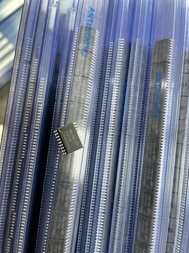 A stack of various electronic components neatly arranged inside a transparent plastic bag.