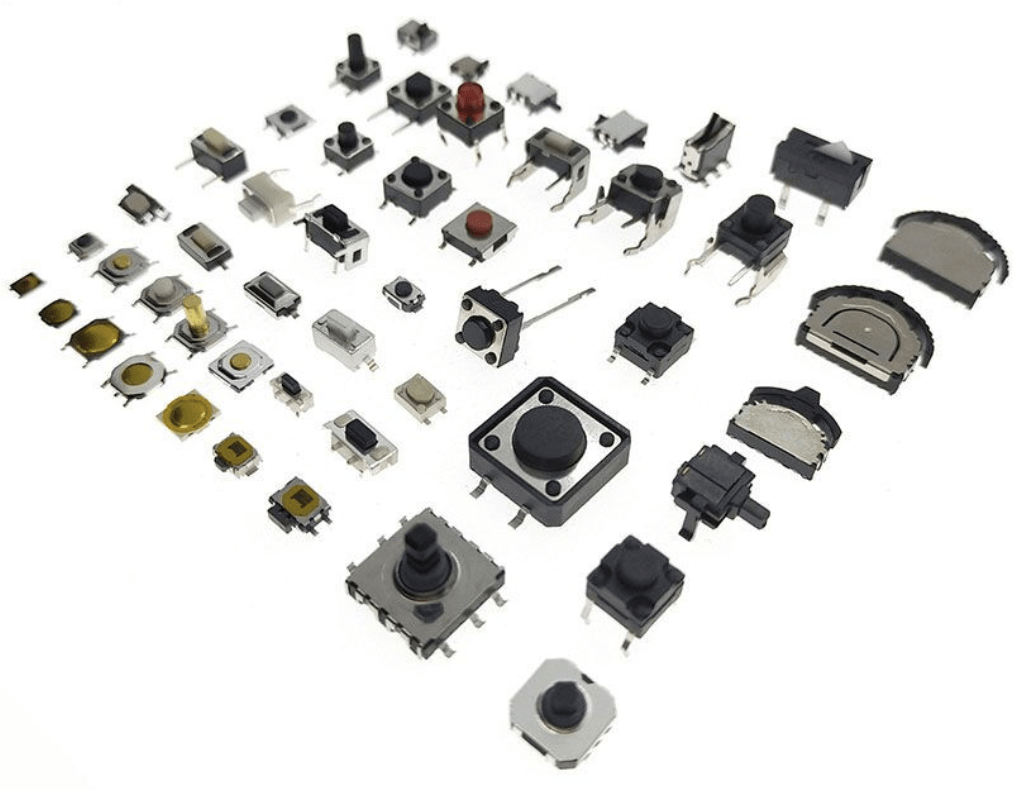 A collection of various electronic components, including resistors, capacitors, and circuit boards, arranged together.