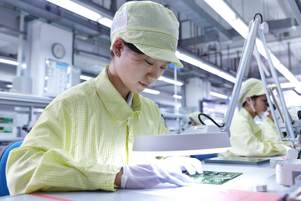 Young woman working at quality check station