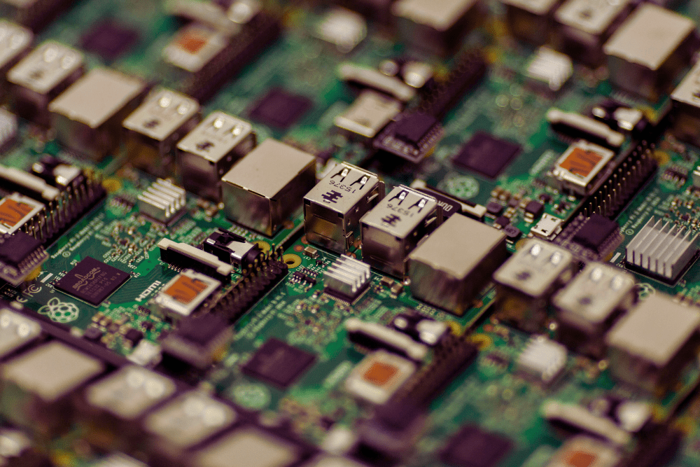 A close-up view of multiple Raspberry Pi single-board computers arranged in a grid-like pattern, featuring USB ports, HDMI ports, and various electronic components.